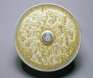 When Taxile Doat arrived at University City to teach porcelain techniques in 1909, he brought with him a study collection of examples he had produced while working in the Sevres factory or his French studio. One of hiss favorite forms was a glazed circular charger with a classical pate-sur-pate medallion at its center. Similar examples have sold on the American and European auction markets in the $3,000-$7,000 range. St. Louis Art Museum image